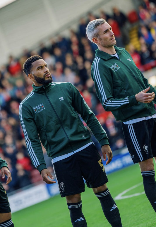 A Charitable Twist in Football Fashion: Salford City FC's Retro Jacket Unveiled